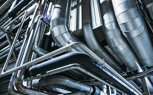 How can an ultrasonic flow meter optimize hydronic HVAC system?

