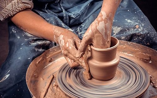 What temperature should pottery be fired at?
