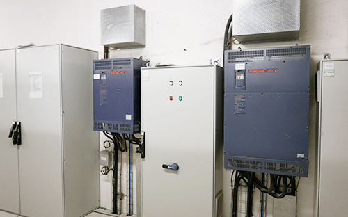 Industrial electrical cabinets incorporating Fuji Electric frequency converters installed in the technical room for motor control