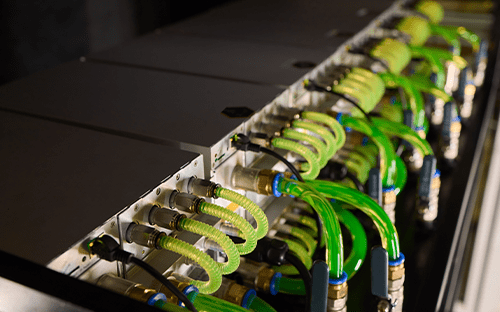 Liquid cooling system with green pipes connected to rack servers